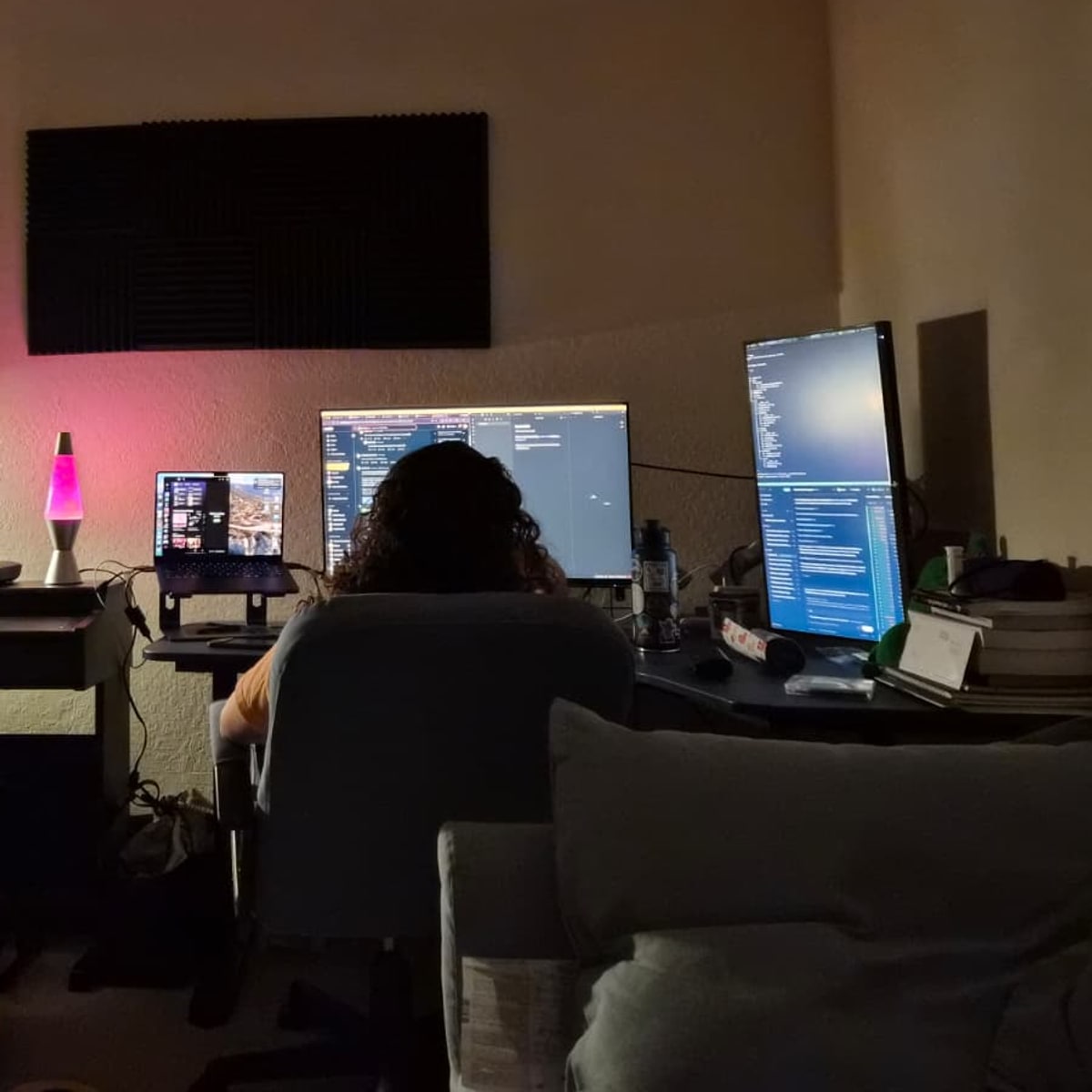 Mete Morris working at a home studio desk